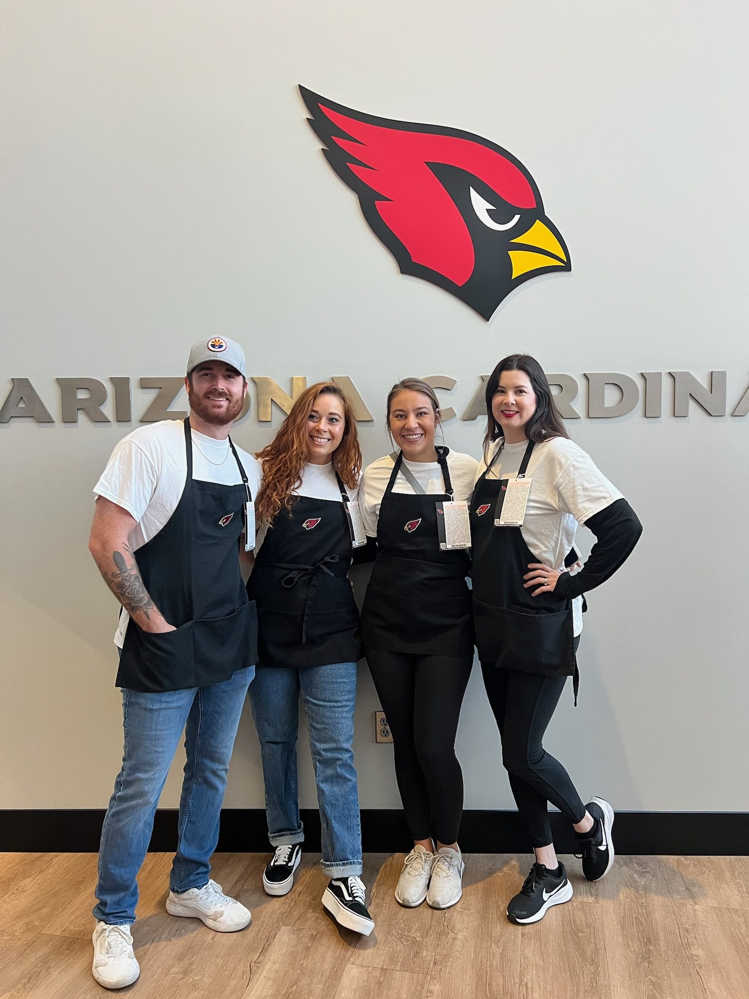 Volunteers in aprons at a community event