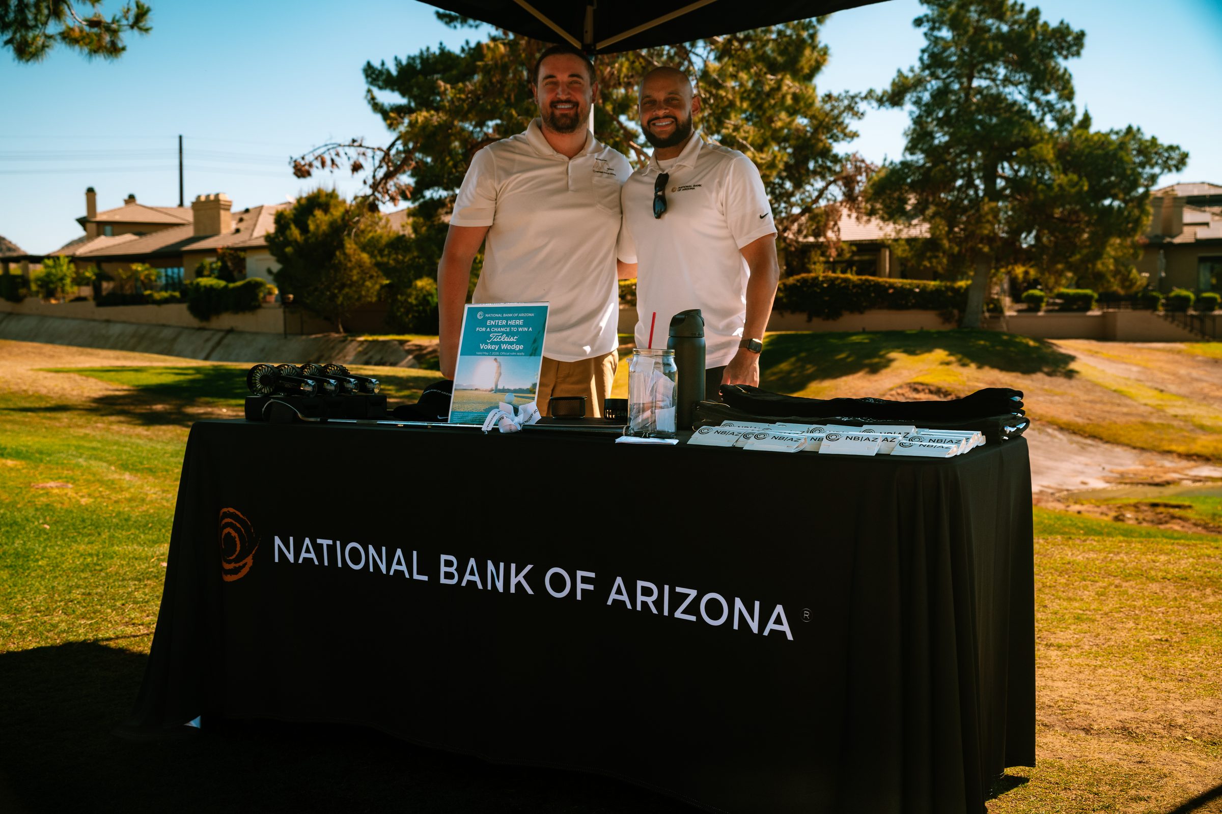 National Bank of Arizona sponsors at their table on the course at the golf classic