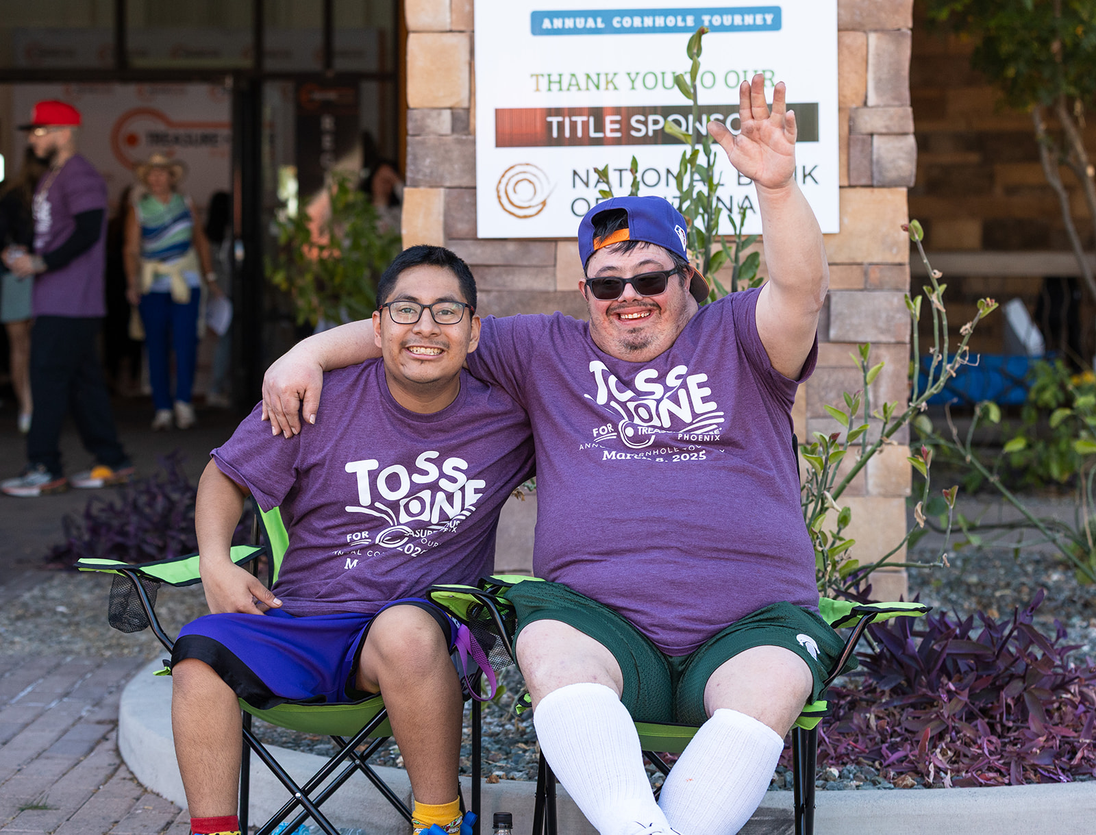 Two residents at the annual cornhole tournament