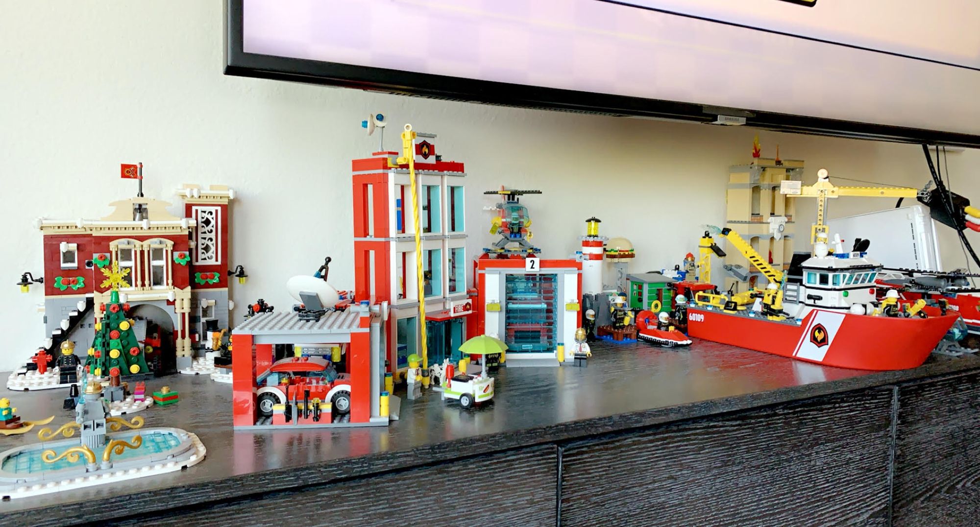Callan's Lego sets on a bookcase
